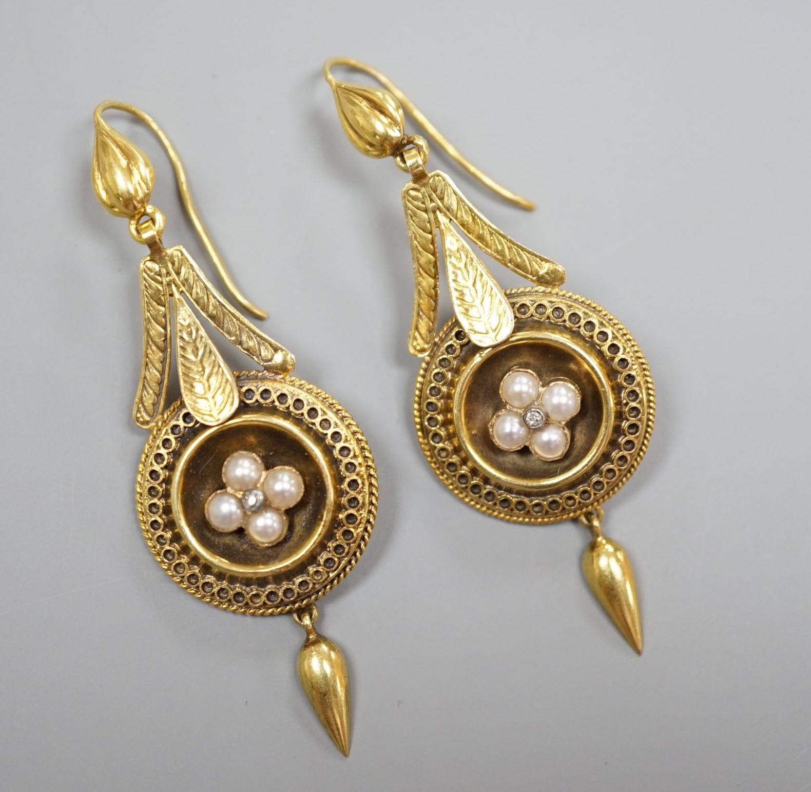 A pair of antique yellow metal, split pearl and diamond chip set drop earrings, overall 54mm, gross weight 5.9 grams.